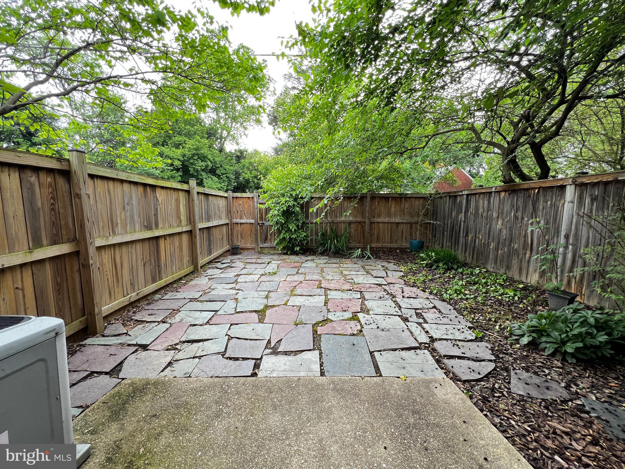 12824 Epping Terrace Silver Spring, MD 20906 - Photo 14 of 23 a backyard of a house with lots of green space