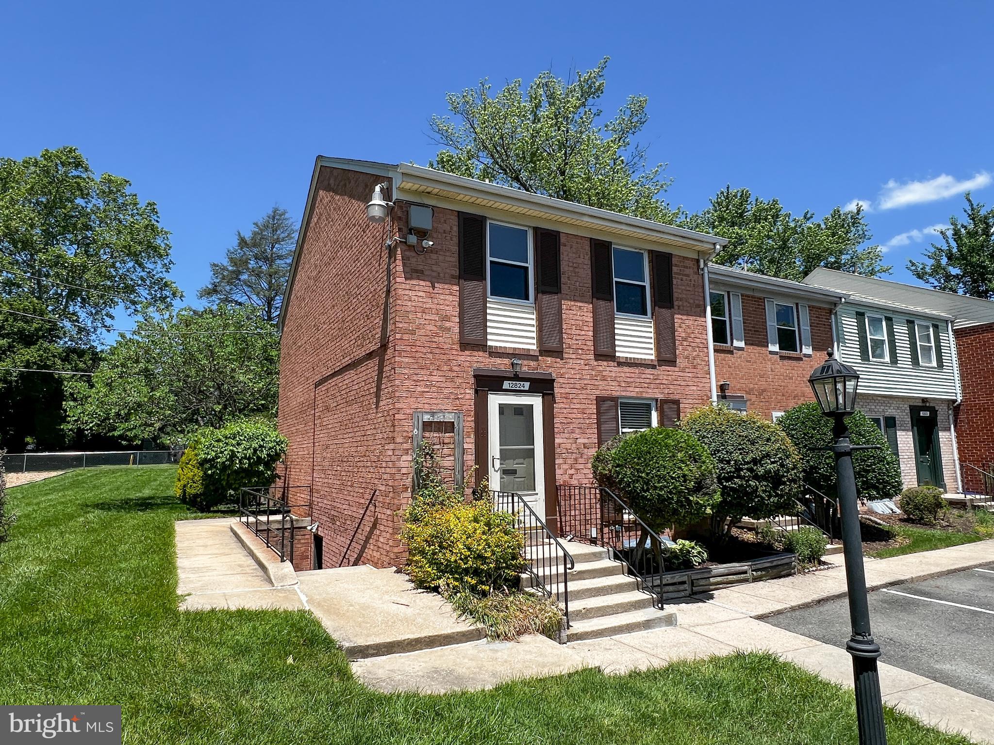 12824 Epping Terrace Silver Spring, MD 20906 - Photo 2 of 23 a front view of a house with a yard