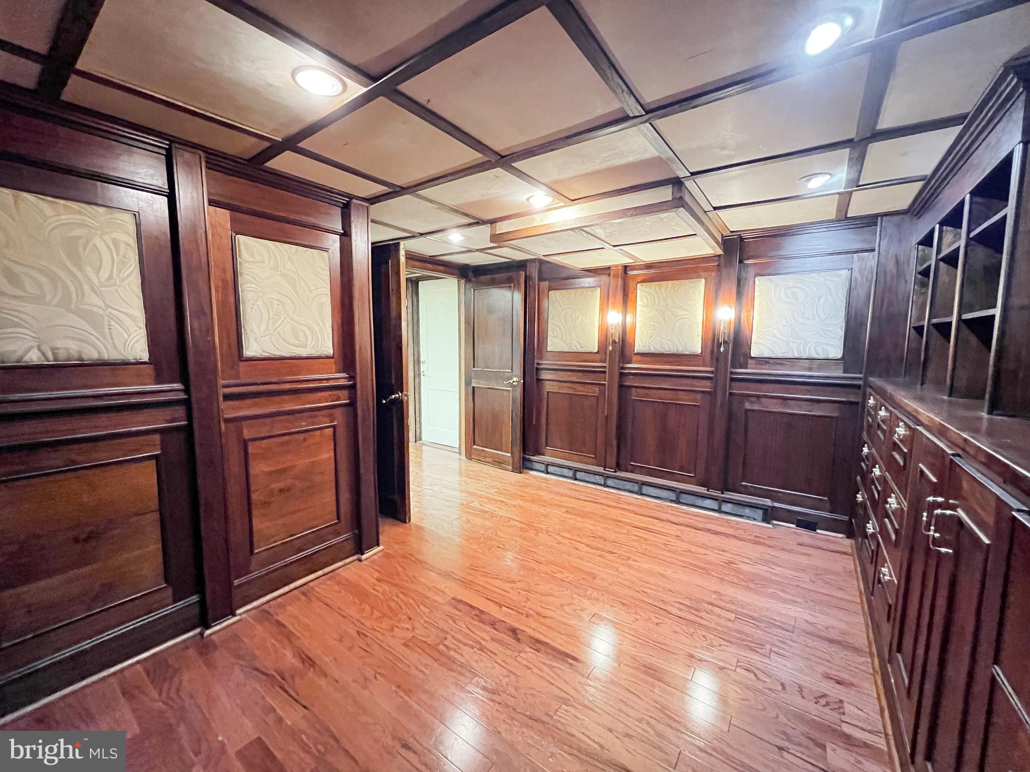 12824 Epping Terrace Silver Spring, MD 20906 - Photo 22 of 23 a view of an empty room with wooden floor and a window