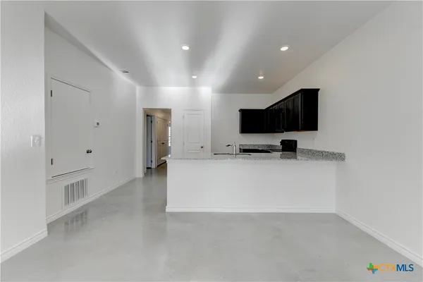 a view of living room with furniture and flat screen tv
