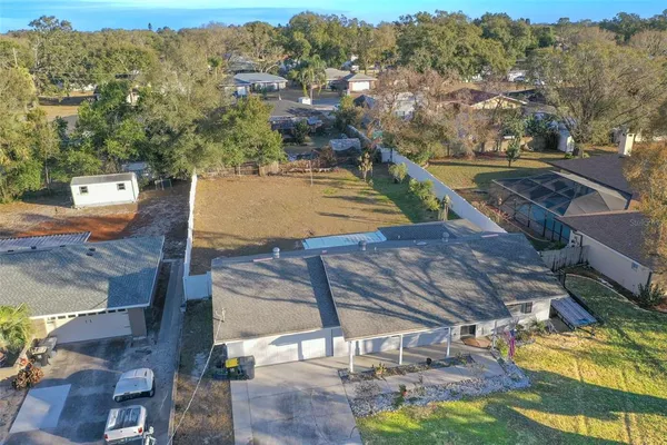 a view of a house with backyard and porch