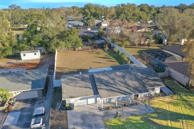 a view of a house with backyard and porch