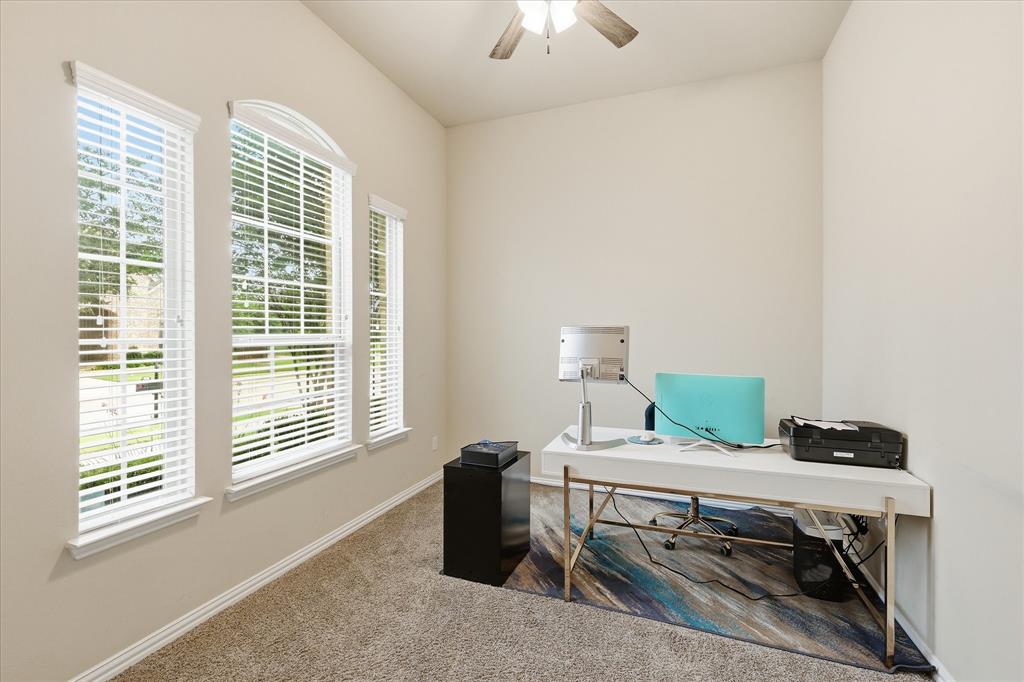 215 Equestrian Road Hickory Creek, TX 75065 - Photo 7 of 36 a view of a workspace with furniture and a window