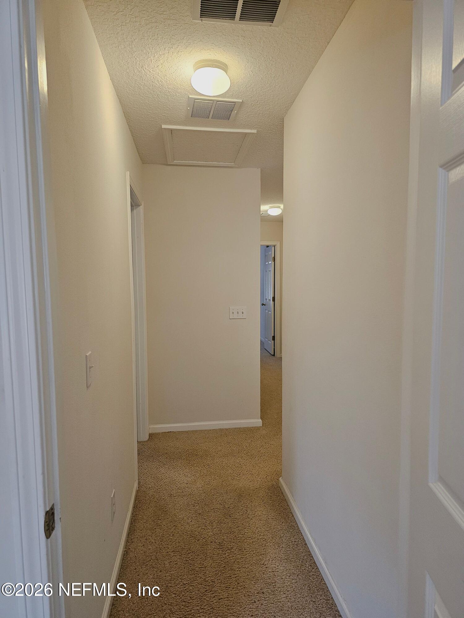 7826 Melvin Road Jacksonville, FL 32210 - Photo 12 of 17 a view of hallway