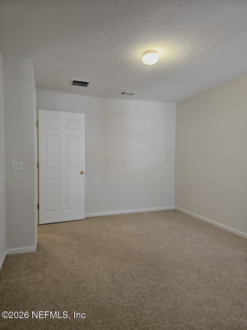 7826 Melvin Road Jacksonville, FL 32210 - Photo 13 of 17 a view of an empty room