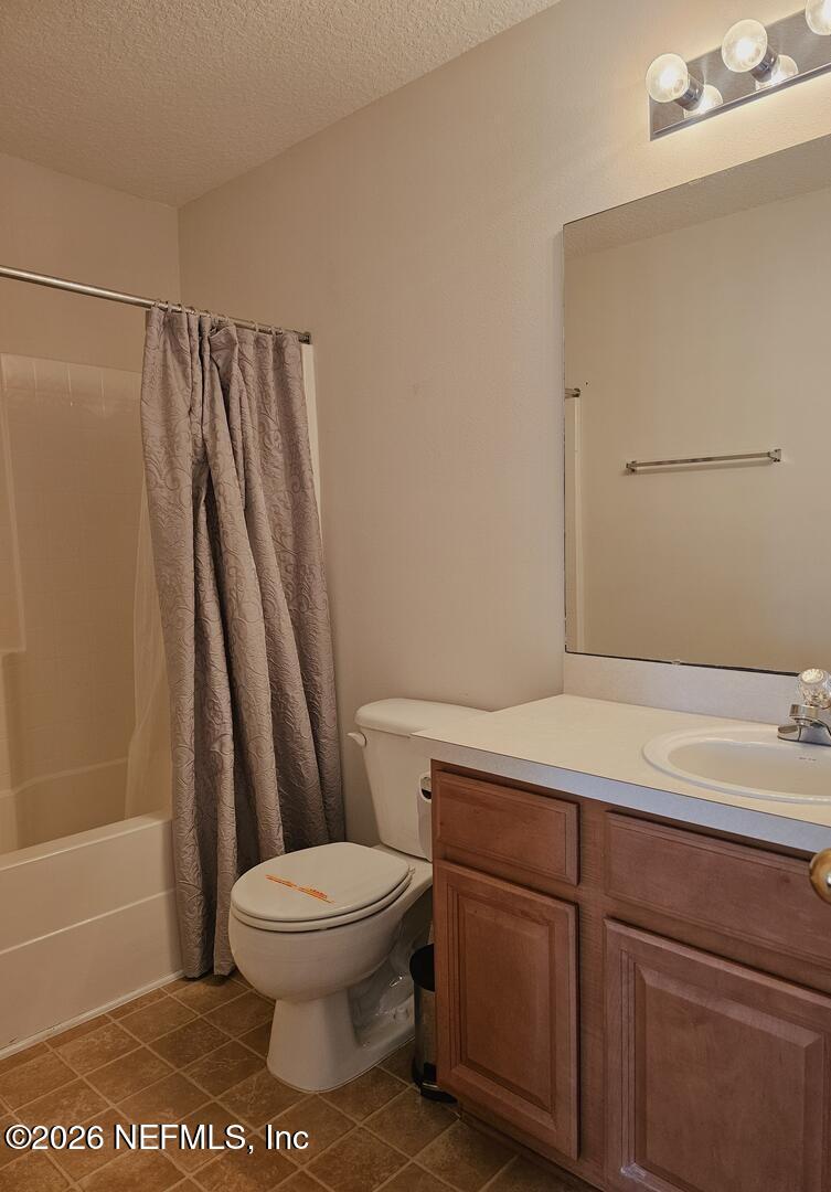 7826 Melvin Road Jacksonville, FL 32210 - Photo 16 of 17 a bathroom with a sink a toilet and shower