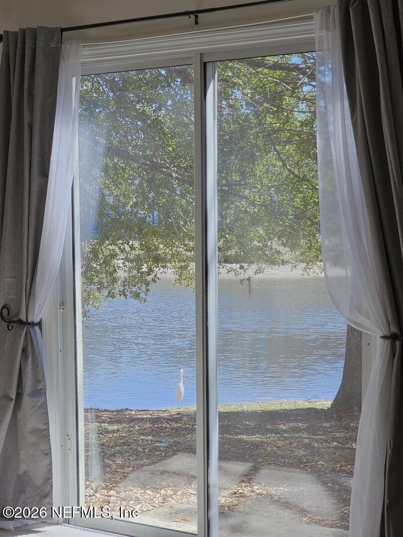7826 Melvin Road Jacksonville, FL 32210 - Photo 5 of 17 a view of a porch