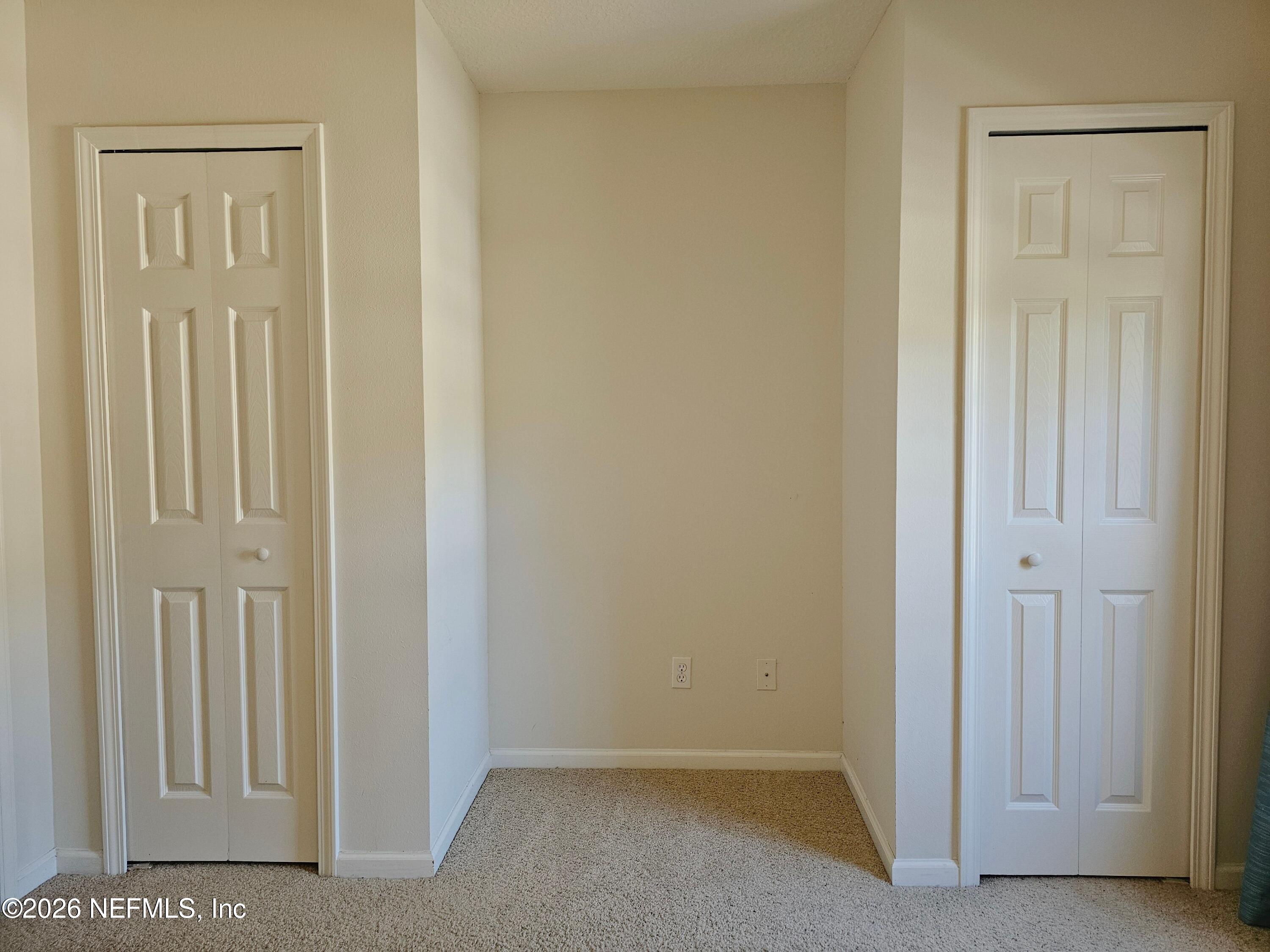 7826 Melvin Road Jacksonville, FL 32210 - Photo 9 of 17 an empty room with windows