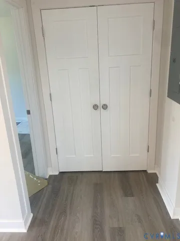 a view of room with hardwood floor