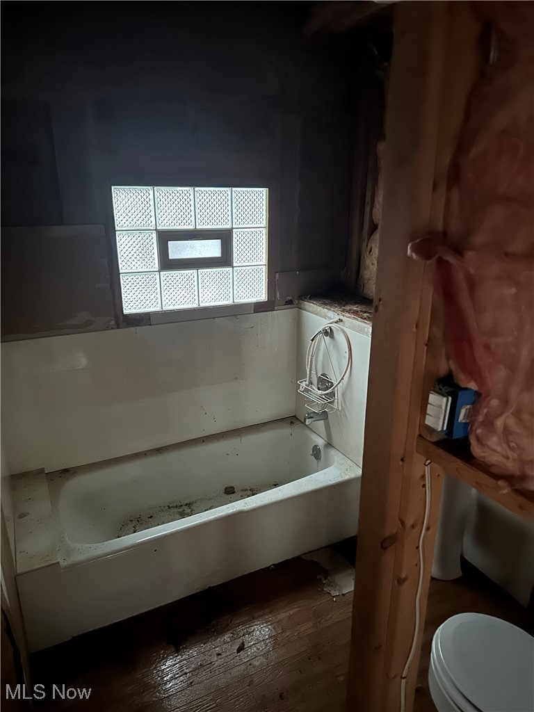 146 Ridgewood Road Wadsworth, OH 44281 - Photo 20 of 20 Bathroom with wood-type flooring, a bathing tub, and toilet