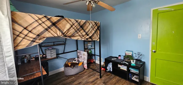 a bedroom with furniture and a closet