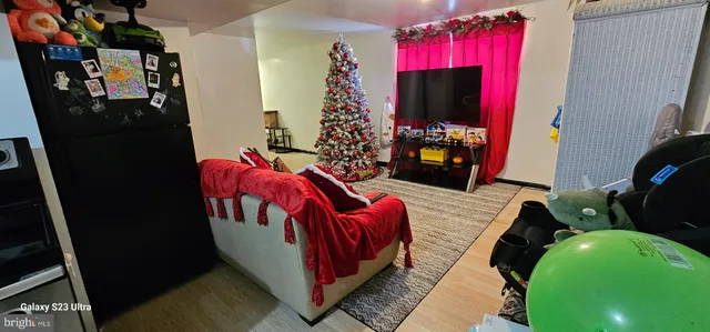 a view of room with window and hardwood