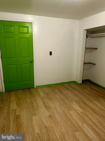 a bathroom with a toilet a sink and a mirror