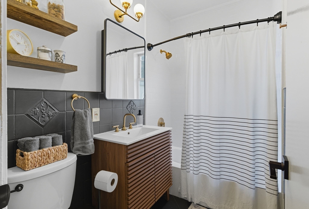 20 Rice Street, Unit 2 Brookline, MA 02445 - Photo 13 of 27 a bathroom with a sink and a mirror