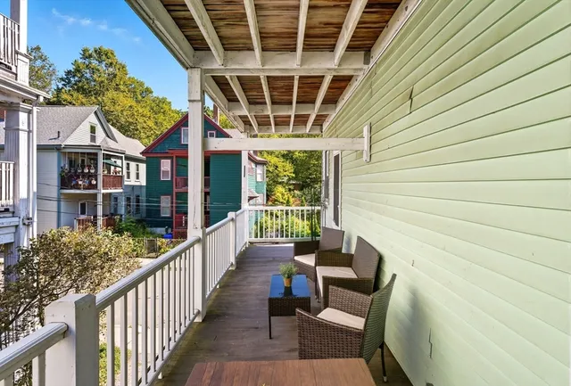a view of a porch with furniture