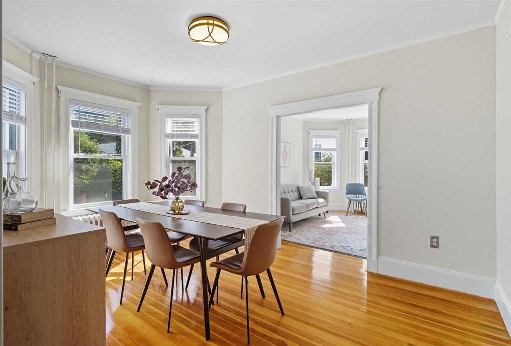 20 Rice Street, Unit 2 Brookline, MA 02445 - Photo 8 of 27 a view of a dining room with furniture and wooden floor