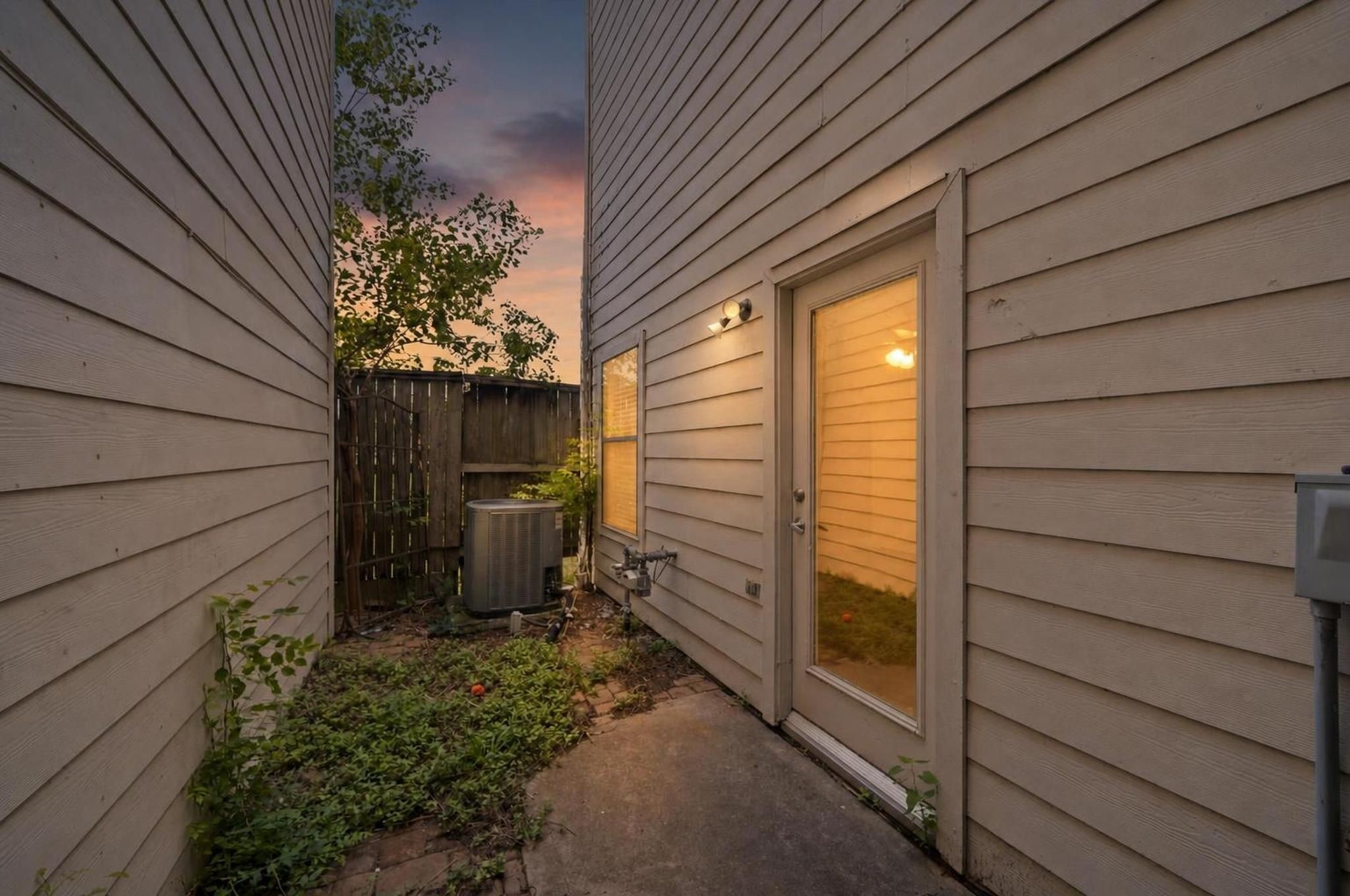 2154 Arabelle Street Houston, TX 77007 - Photo 41 of 45 The back patio offers a private outdoor escape tucked behind the home. It is an easy place for plants, a small seating area, or a quiet moment outside.