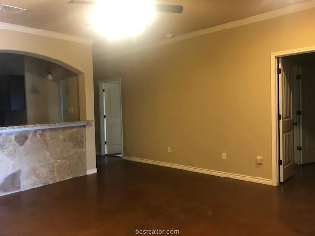 an empty room with wooden floor