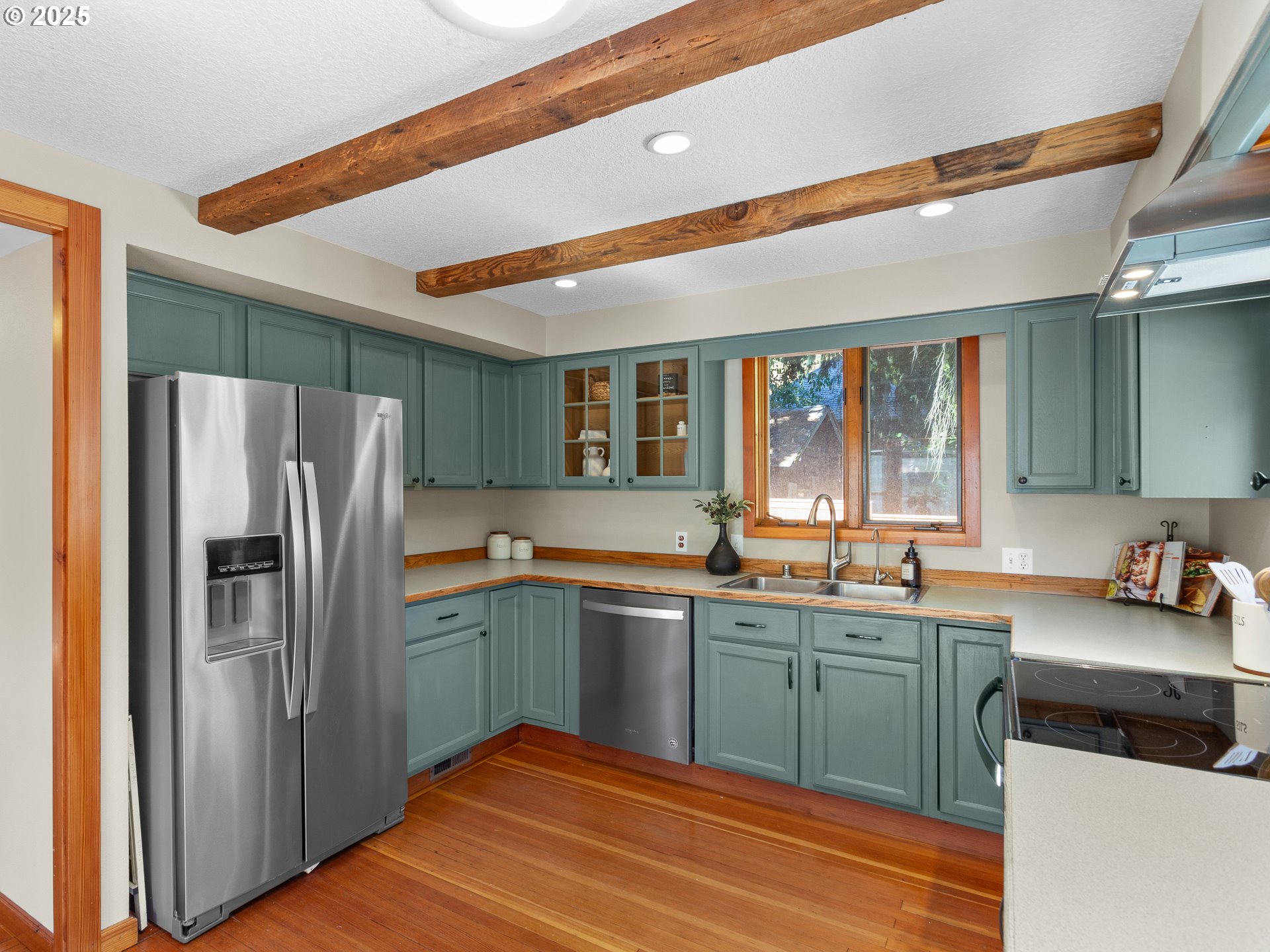 912 Northwest Fargo Street Camas, WA 98607 - Photo 12 of 44 a kitchen with a sink stainless steel appliances and cabinets