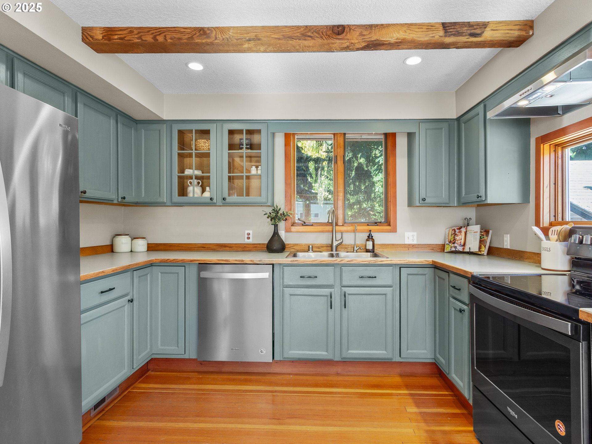 912 Northwest Fargo Street Camas, WA 98607 - Photo 13 of 44 a kitchen with stainless steel appliances granite countertop a sink and dishwasher next to a window