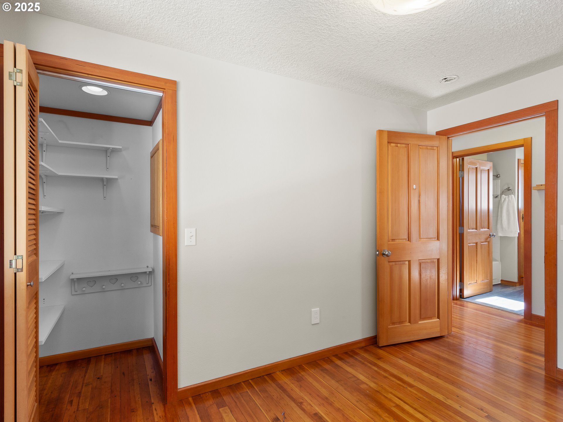 912 Northwest Fargo Street Camas, WA 98607 - Photo 17 of 44 a view of an empty room with wooden floor and a window