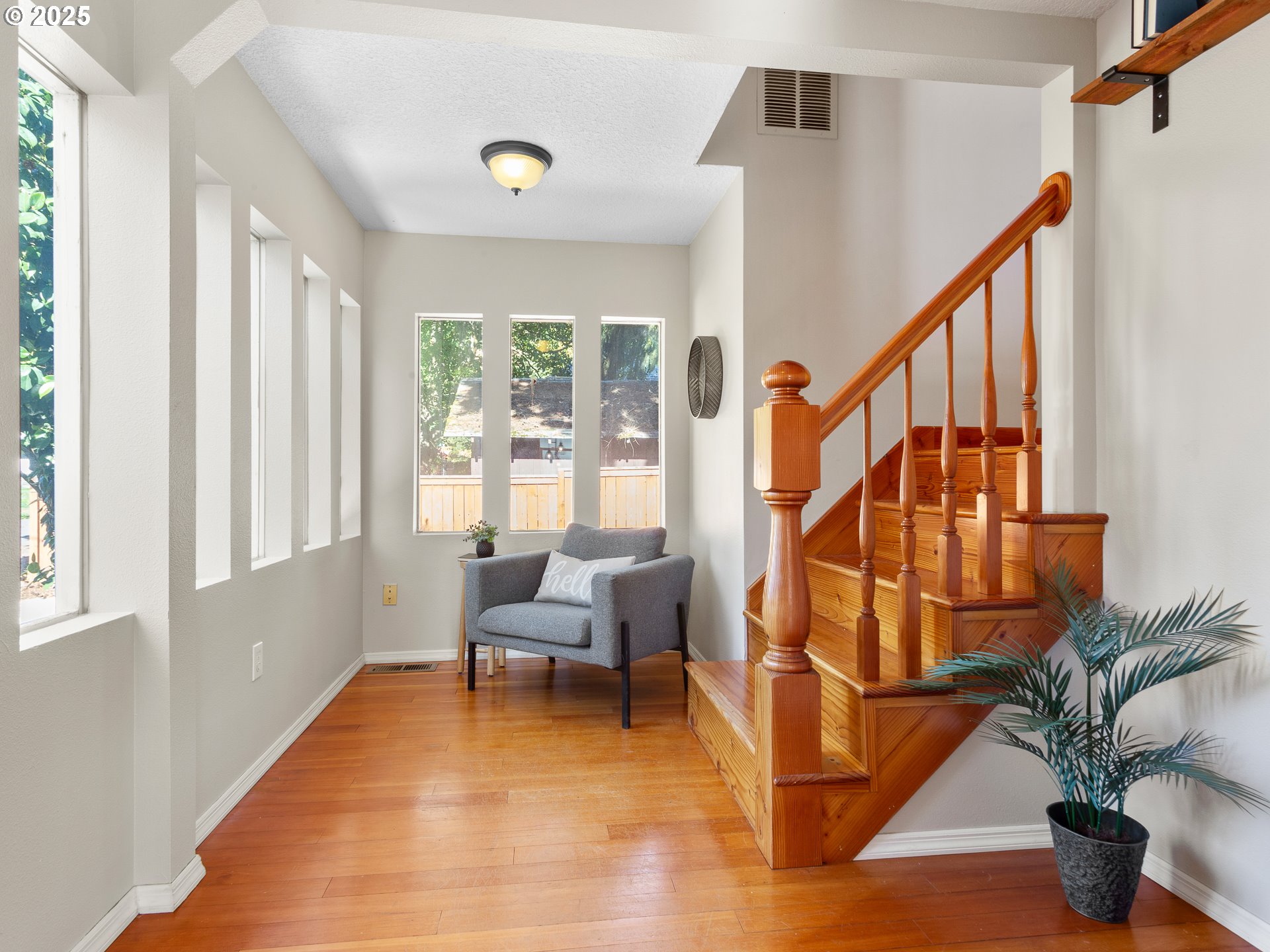 912 Northwest Fargo Street Camas, WA 98607 - Photo 19 of 44 a living room with balcony furniture and a potted plant