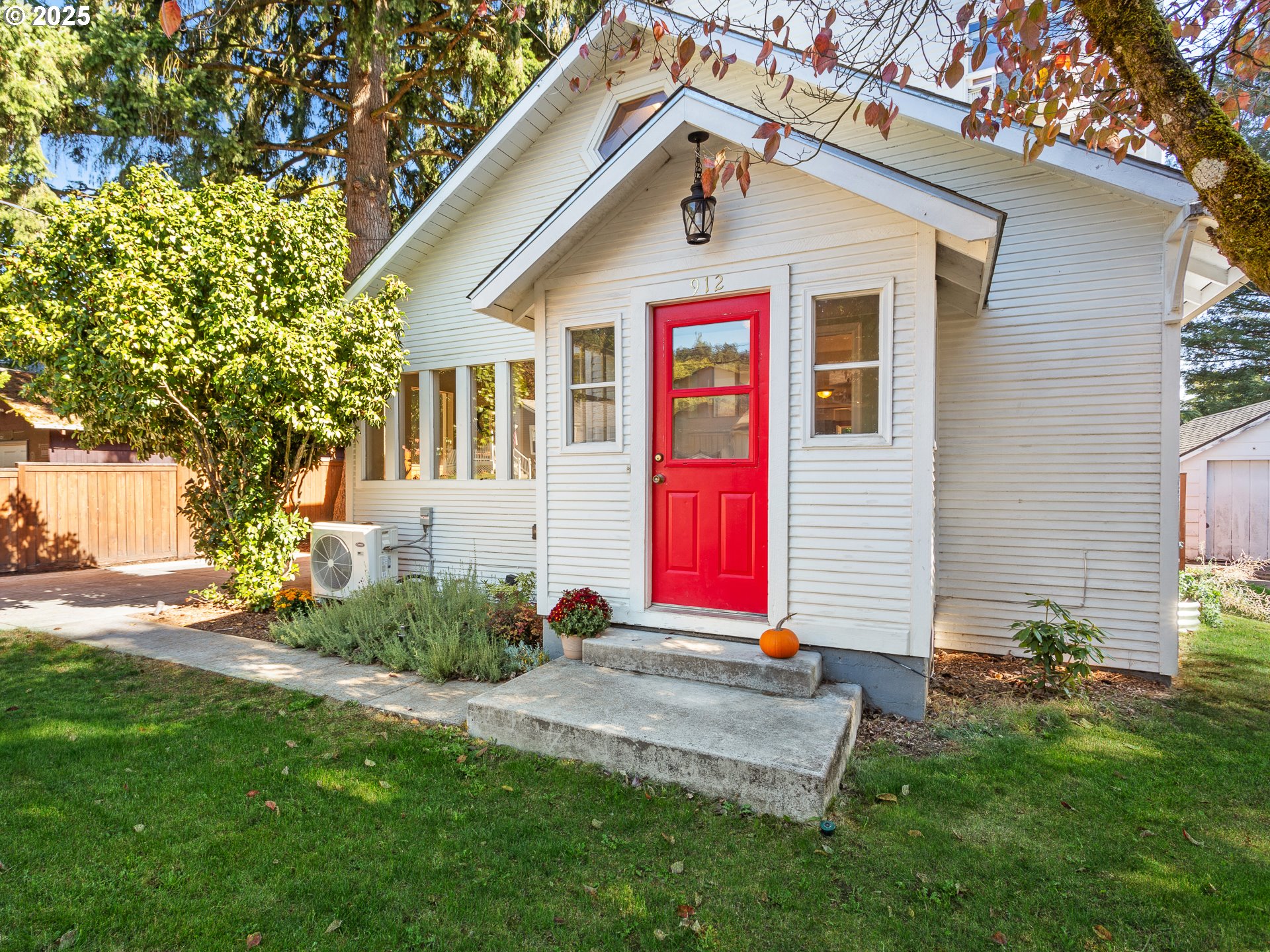 912 Northwest Fargo Street Camas, WA 98607 - Photo 3 of 44 a front view of a house with a yard and trees