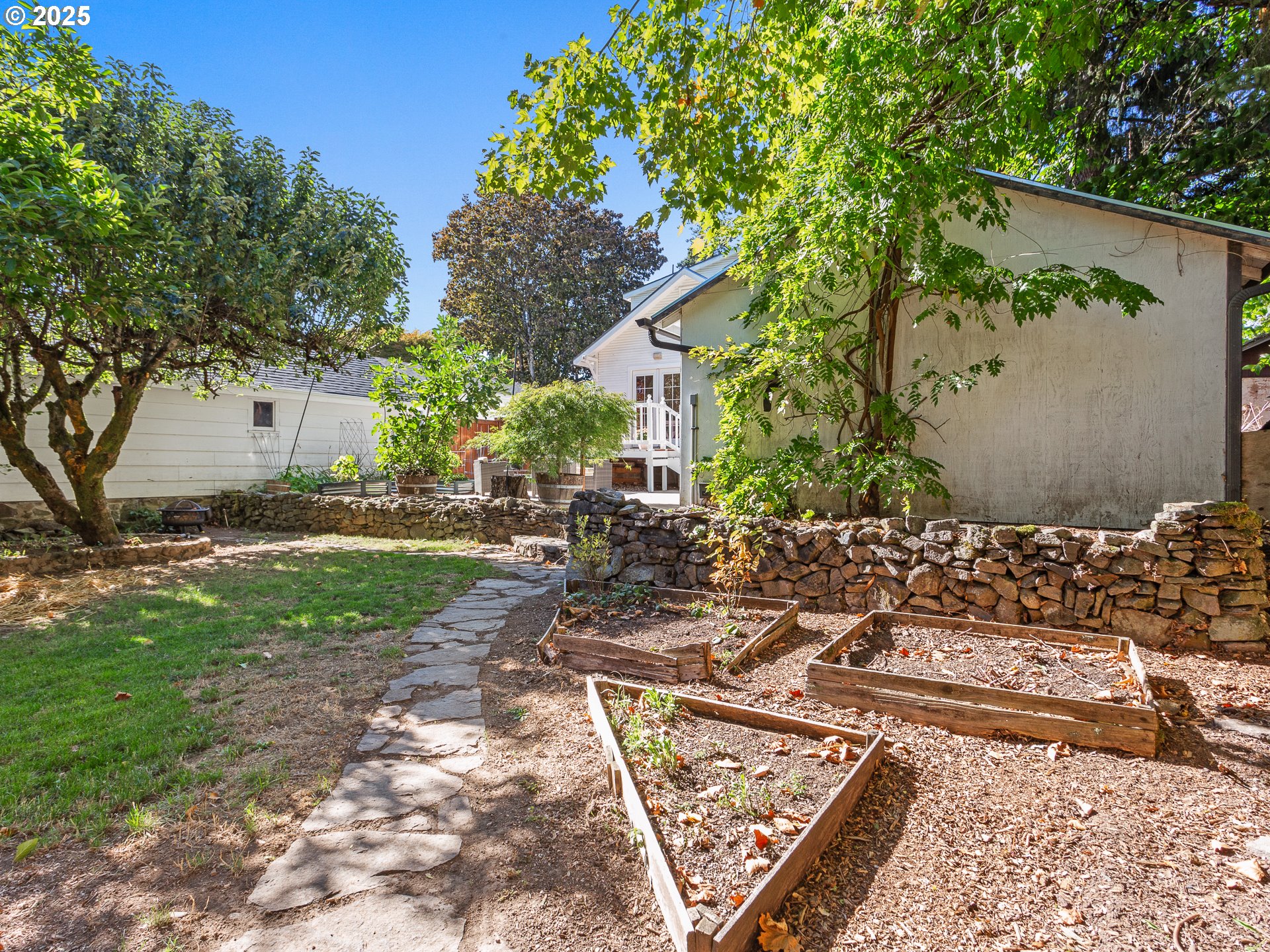 912 Northwest Fargo Street Camas, WA 98607 - Photo 39 of 44 a view of a backyard with plants and a patio