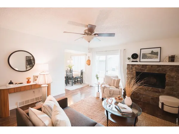 a living room with furniture and a fireplace