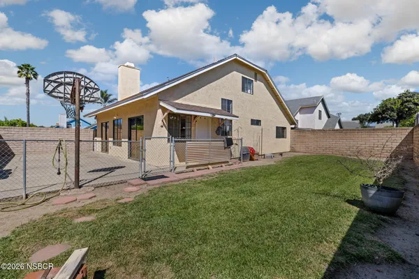 a view of a back yard of the house