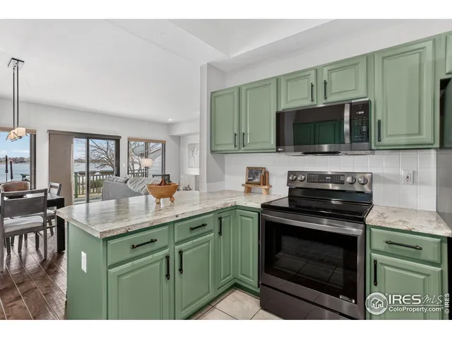 a kitchen with a sink stove and microwave