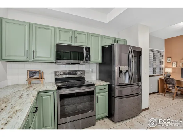 a kitchen with a refrigerator stove and microwave