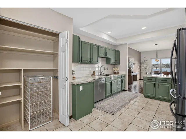 a kitchen with a sink cabinets and window