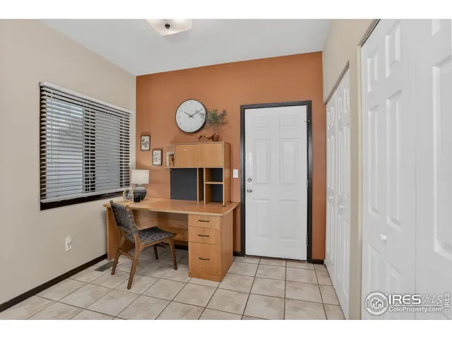 a view of a livingroom with furniture and a window