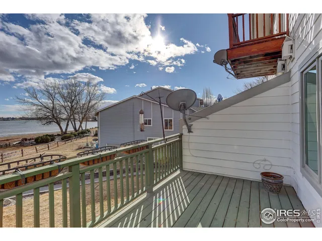 a view of a balcony with wooden floor