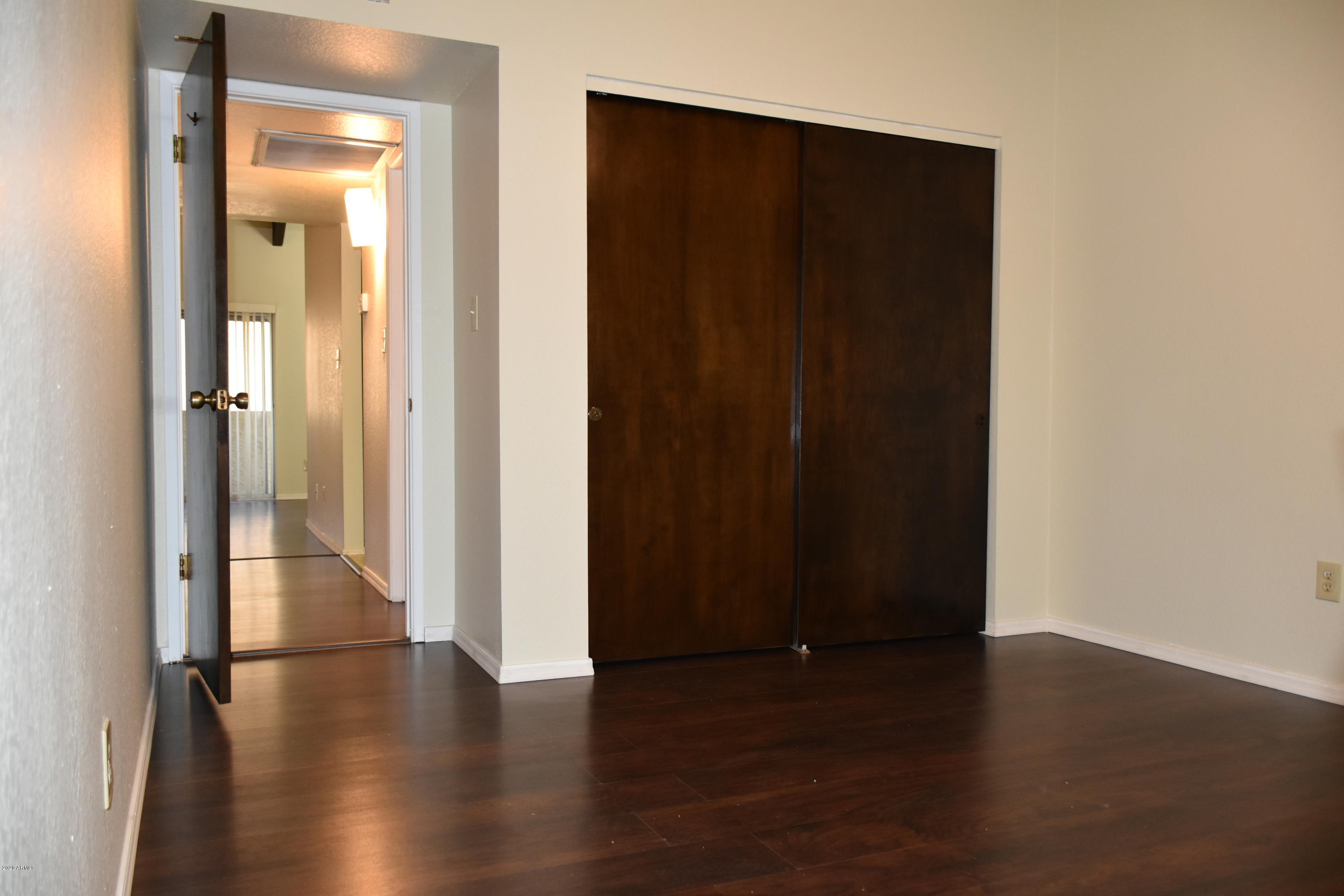 2060 South Rural Road, Unit C Tempe, AZ 85282 - Photo 1 of 8 a view of a hallway with wooden floor