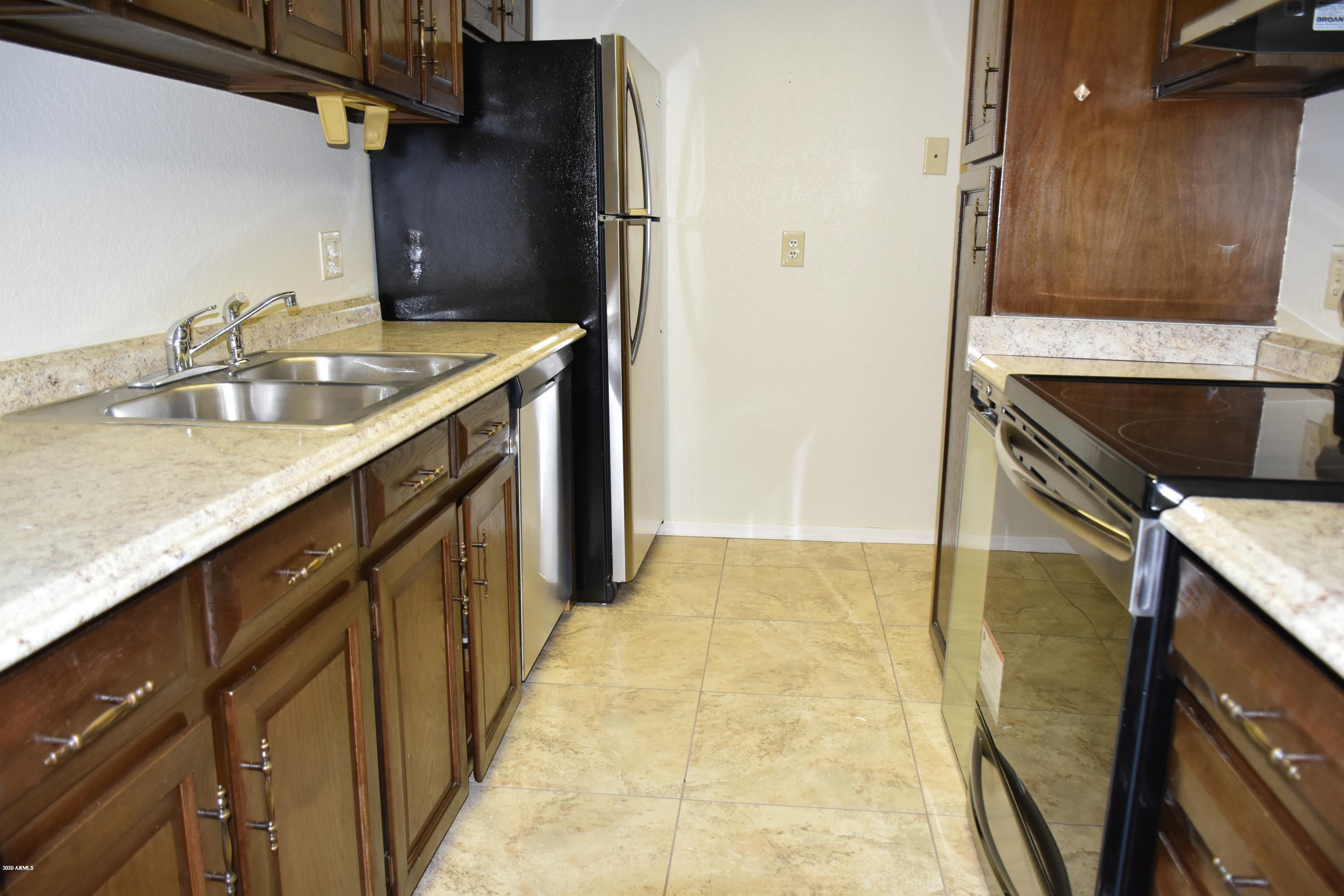 2060 South Rural Road, Unit C Tempe, AZ 85282 - Photo 2 of 8 a bathroom with a granite countertop sink a mirror and shower