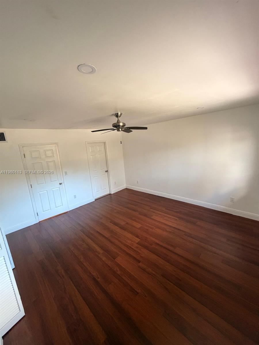 7101 Southwest 113th Court Miami, FL 33173 - Photo 17 of 30 an empty room with wooden floor