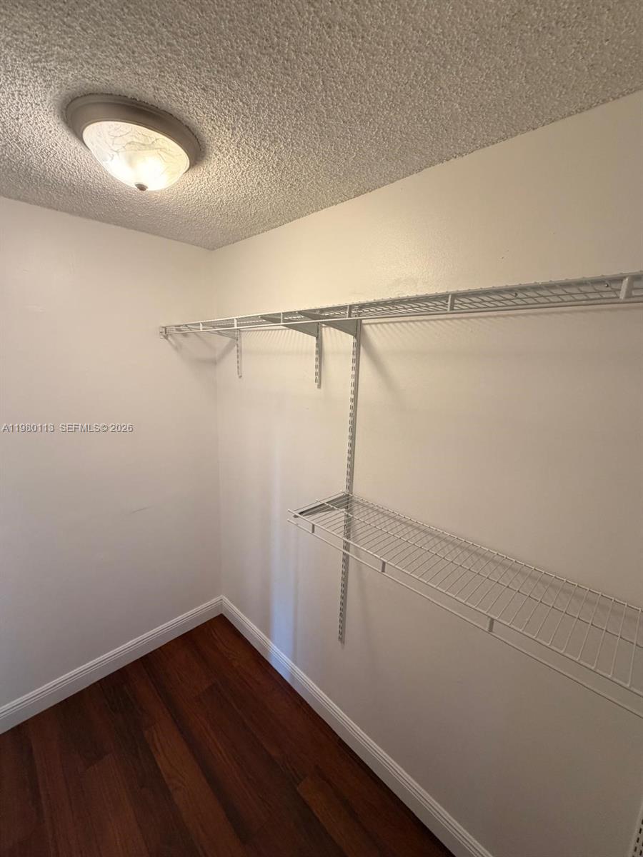 7101 Southwest 113th Court Miami, FL 33173 - Photo 22 of 30 a view of a room with racks on the wall