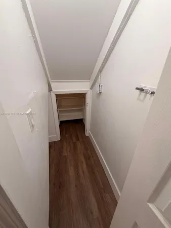 a view of entryway with wooden floor