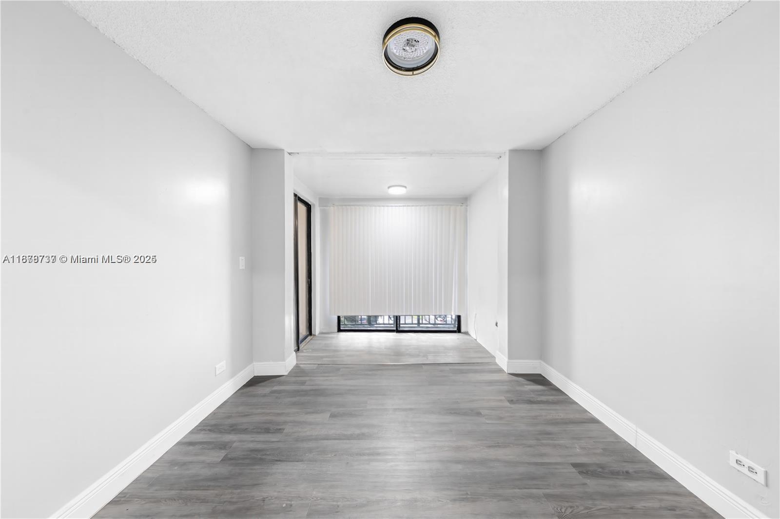 3680 Inverrary Drive, Unit 3J Lauderhill, FL 33319 - Photo 10 of 16 a view of an empty room with a window