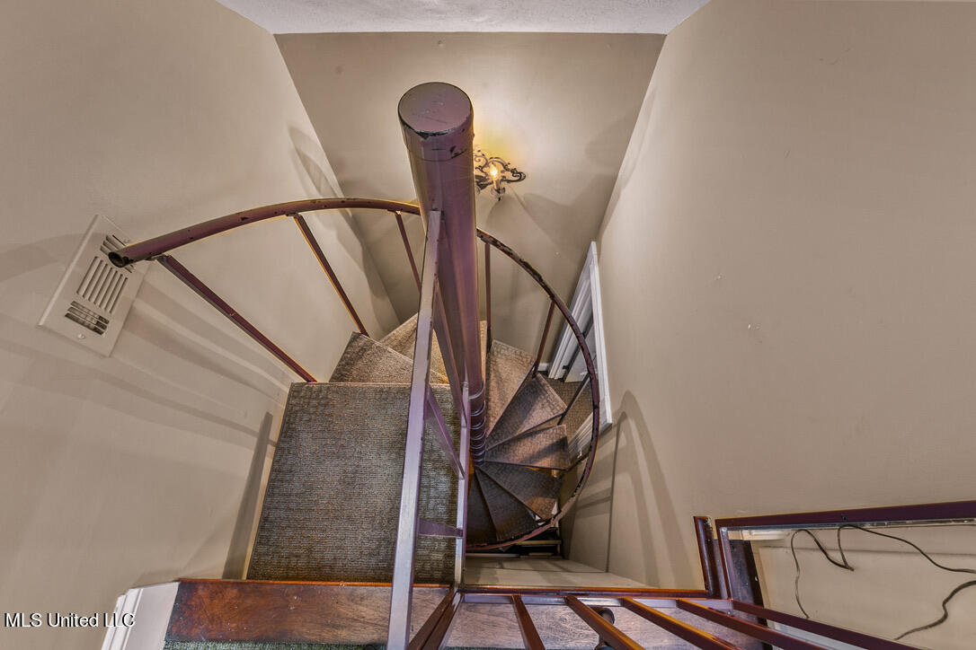 133 Overlook Pointe Drive Ridgeland, MS 39157 - Photo 87 of 93 Spiral Stairs to Gound Floor