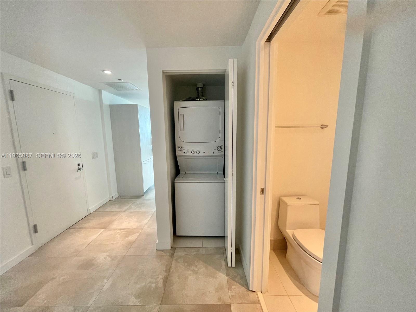 501 Northeast 31st Street, Unit 3007 Miami, FL 33137 - Photo 12 of 14 a view of a bathroom with a toilet and a shower