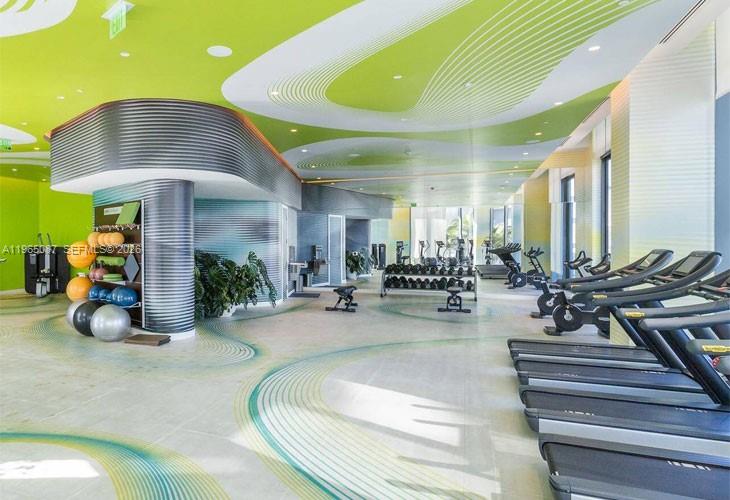 501 Northeast 31st Street, Unit 3007 Miami, FL 33137 - Photo 3 of 14 a room with lots of furniture and a chandelier