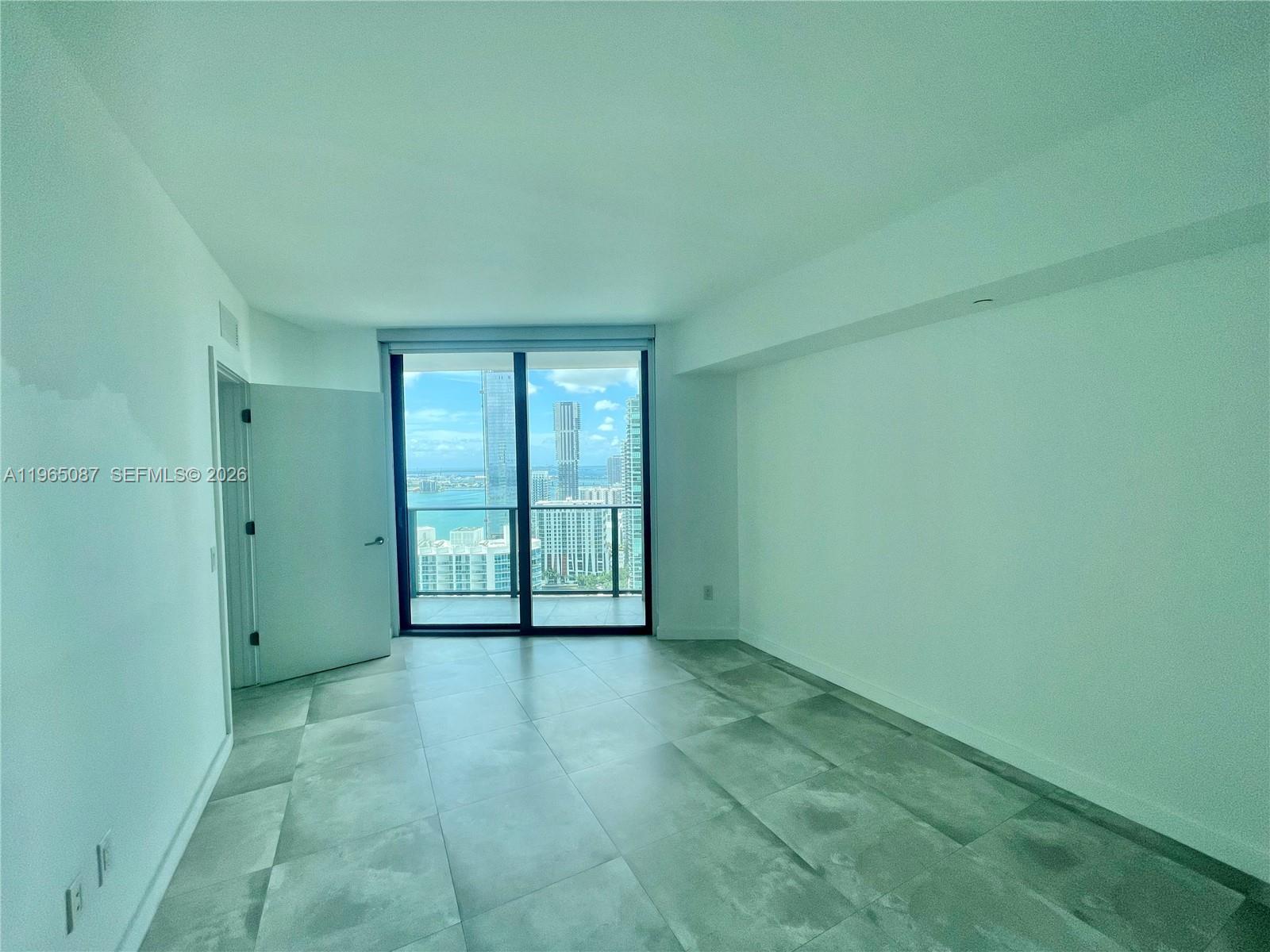 501 Northeast 31st Street, Unit 3007 Miami, FL 33137 - Photo 7 of 14 a view of an empty room with a window