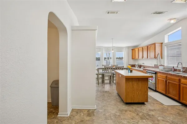 a kitchen with stainless steel appliances a stove sink and microwave