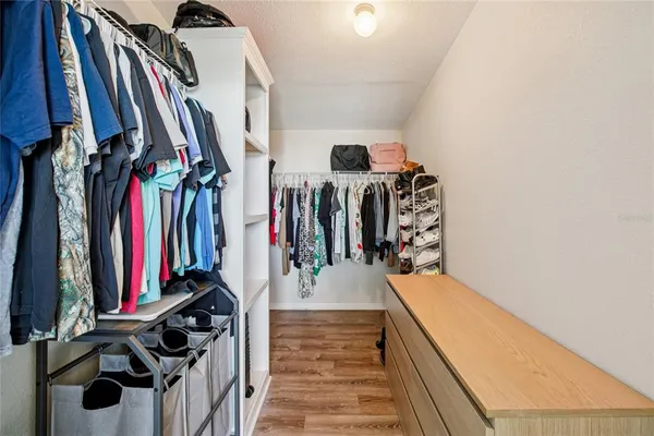 a bedroom with a bed and a table