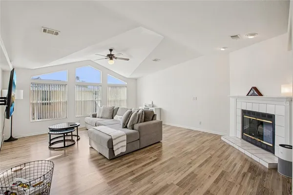 a living room with furniture and a fireplace