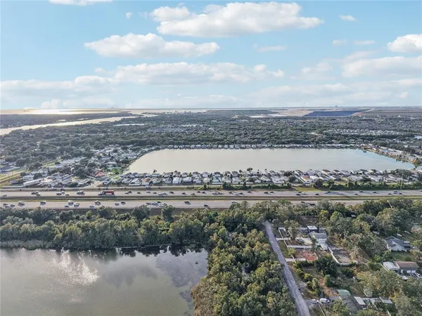 an aerial view of residential houses with ocean view