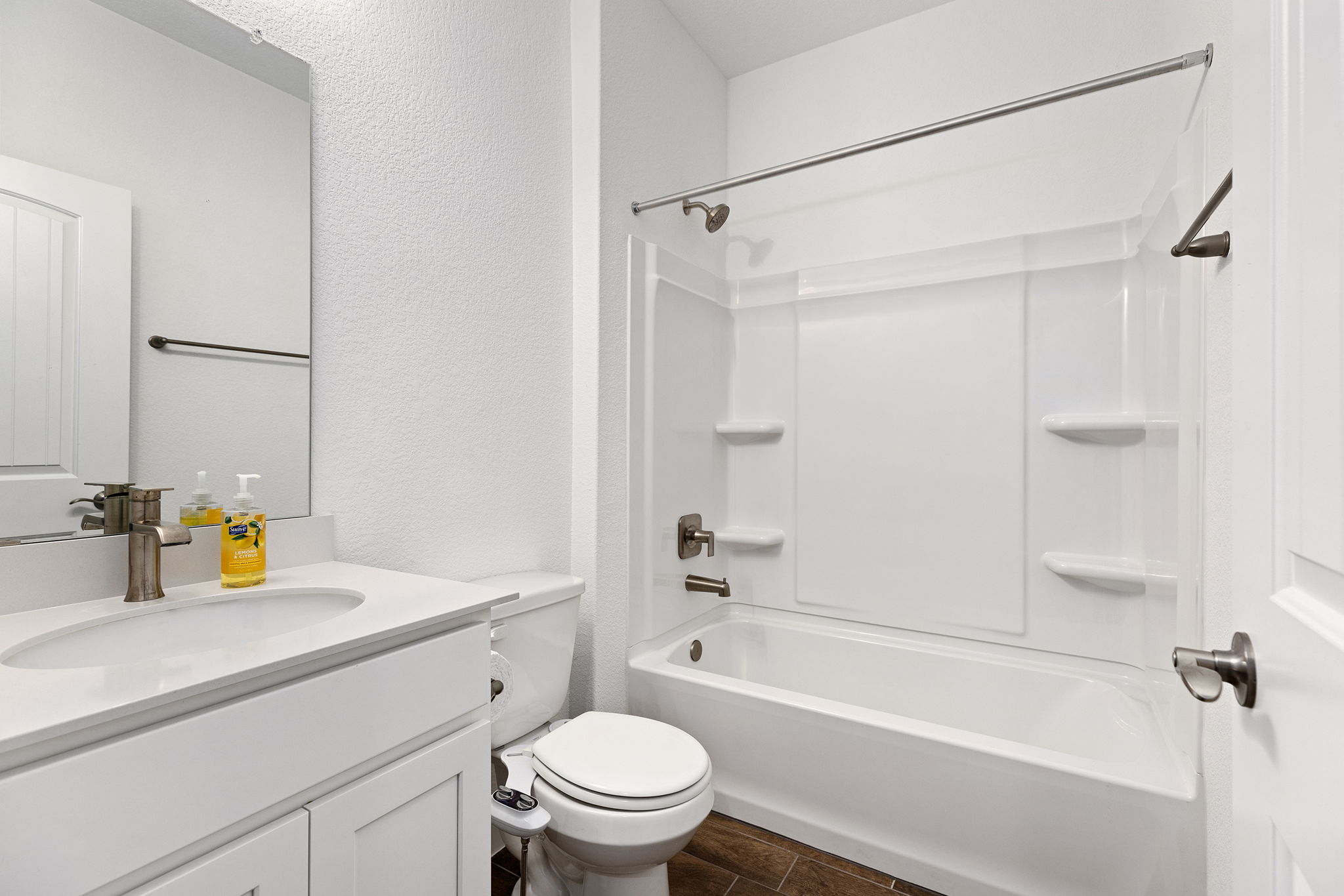 116 Raleigh Drive Georgetown, TX 78633 - Photo 21 of 28 A well-appointed bathroom features a bright vanity, modern fixtures, and a tub-shower combination.